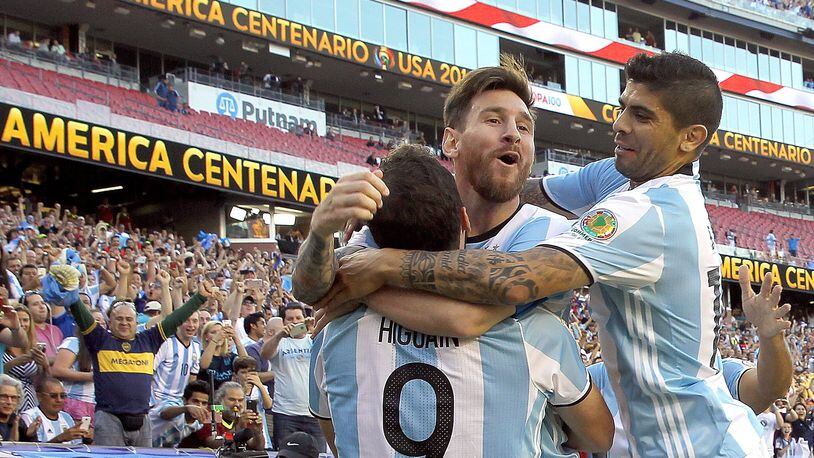 Gonzalo Higuain, left, of Argentina, celebrates his goal with Lionel Messi, center, and Ever Banega in the first half during the 2016 Copa America Centenario quarterfinal match against Venezuela at Gillette Stadium on June 18, 2016 in Foxboro, Massachusetts. (Photo by Jim Rogash/Getty Images)