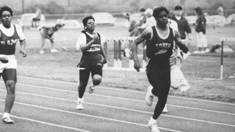 Nicole Green (right) is one of the most decorated track athletes in Springfield history. Green, Charles Steiner, Sheila Evans and Eric Bauer will be into the district's athletic hall of fame this weekend. Springfield News-Sun file photo