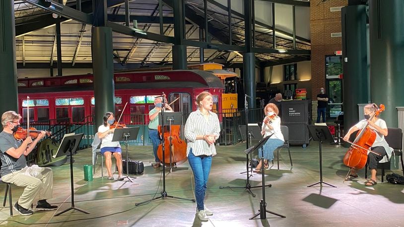 Dayton Opera singer Maya Vansuch rehearses with musicians from Dayton Philharmonic Orchestra at the James F. Dicke Family Transportation Center at Carillon Historical Park. CONTRIBUTED