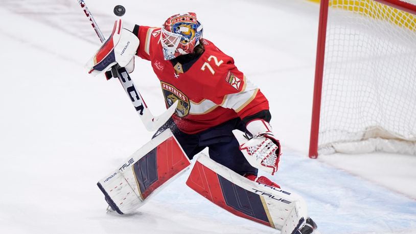 Florida Panthers goaltender Sergei Bobrovsky deflects a shot during the first period of Game 5 of the first-round of an NHL Stanley Cup Playoff series against the Tampa Bay Lightning, Monday, April 29, 2024, in Sunrise, Fla. (AP Photo/Wilfredo Lee)