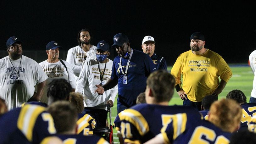 Springfield coach Maurice Douglass talks to the team after a victory against Saint Ignatius on Friday Aug. 20, 2021, at Springfield High School. David Jablonski/Staff
