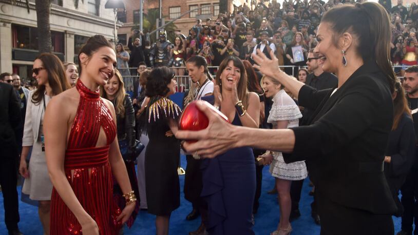 Actors Gal Gadot and Lynda Carter embrace at the premiere of Warner Bros. Pictures' "Wonder Woman" at the Pantages Theatre on Thursday.