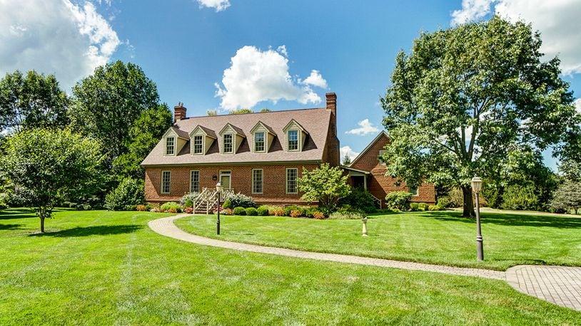 The 4-bedroom, brick, Cape Cod-style home has about 3,030 sq. ft. of living space with a partially finished basement with rec room and bath. The home on 1.13 acres includes an attached, side-entry garage. CONTRIBUTED PHOTO