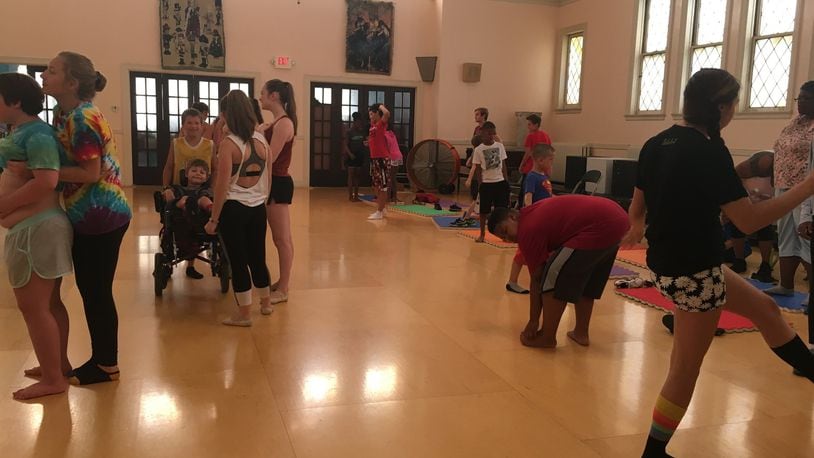 Ohio Performing Arts Institute dancers and Salvation Army Day campers prepare to learn several dances Monday.