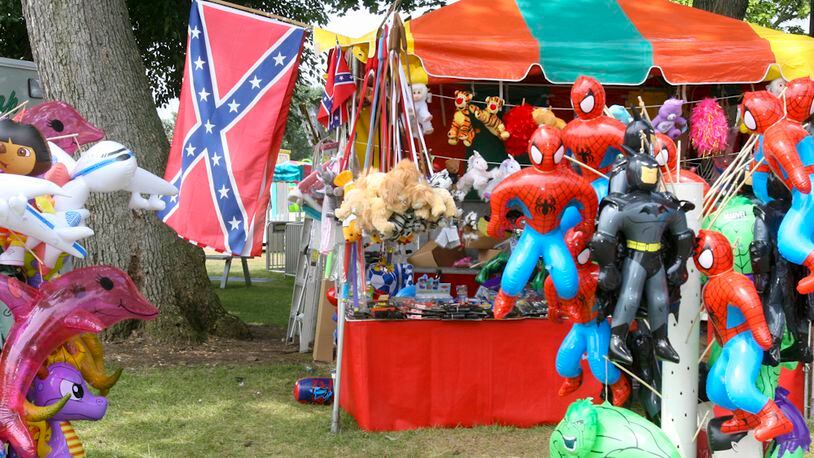In 2006, the Confederate flag was repeatedly seen at the Butler County Fair in the form of hats, T-shirts, belt buckles, and even a Confederate flag used in a horse saddle design. Booths at the fairgrounds had their share of Confederate merchandise, too, including games where people could win large Confederate flags to small mirrors bearing the Confederate flag. GREG LYNCH / STAFF FILE 2006