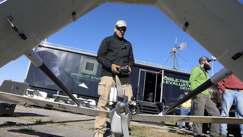 Dave Malek performs a safety check on a UAV before it takes off for one of the Air Force Research Labratory’s test flights at Springfield Beckley Municipal Airport. Bill Lackey/Staff