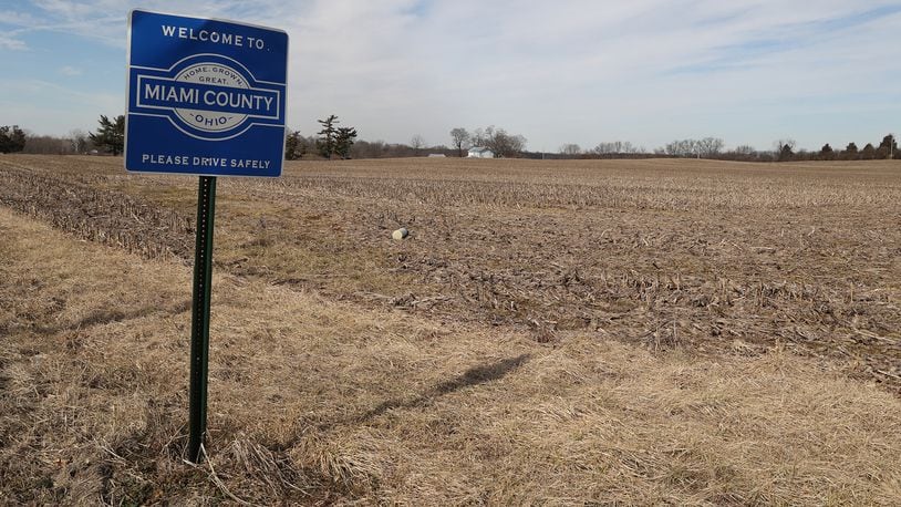 A Miami County farm field at the intersection of Scarff Road and New Carlisle Road where a proposed housing development would be located. BILL LACKEY/STAFF