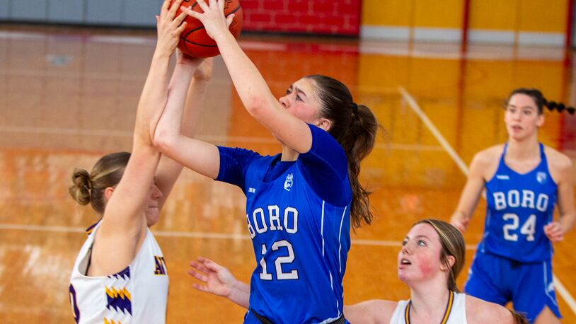 Springboro's Bryn Martin is fouled by Butler during the first half of Saturday's Division I tournament game Saturday at Troy High School. Jeff Gilbert/CONTRIBUTED