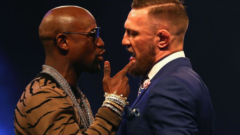 Floyd Mayweather (left) and Conor McGregor continue to hype their upcoming fight.