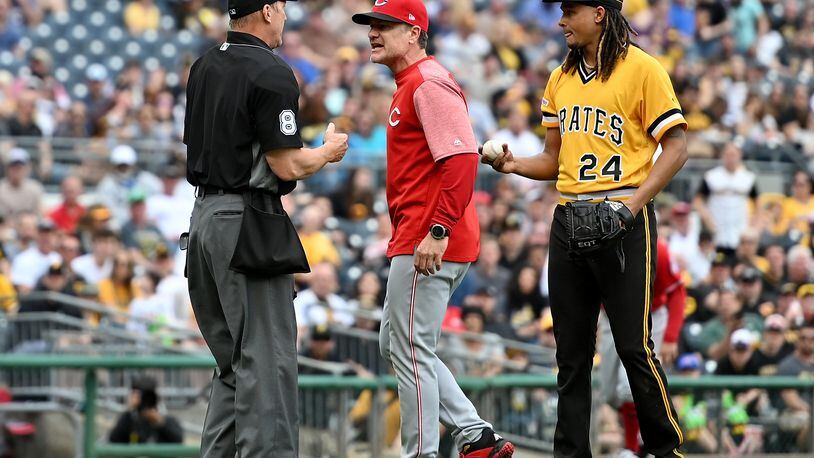 PITTSBURGH, PA - APRIL 07: David Bell #25 of the Cincinnati Reds argues with umpire Jeff Kellogg #8 as Chris Archer #24 of the Pittsburgh Pirates looks on in the fourth inning during the game at PNC Park on April 7, 2019 in Pittsburgh, Pennsylvania. (Photo by Justin Berl/Getty Images)