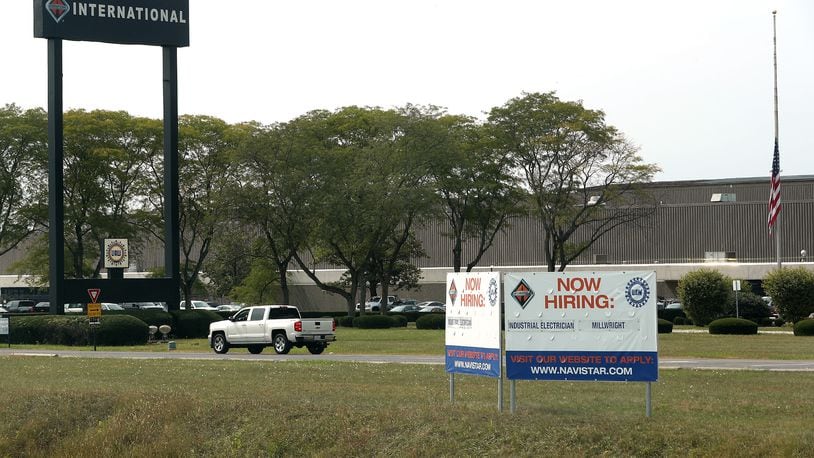 A "Now Hiring" sign has been placed in front of Navistar Wednesday. BILL LACKEY/STAFF