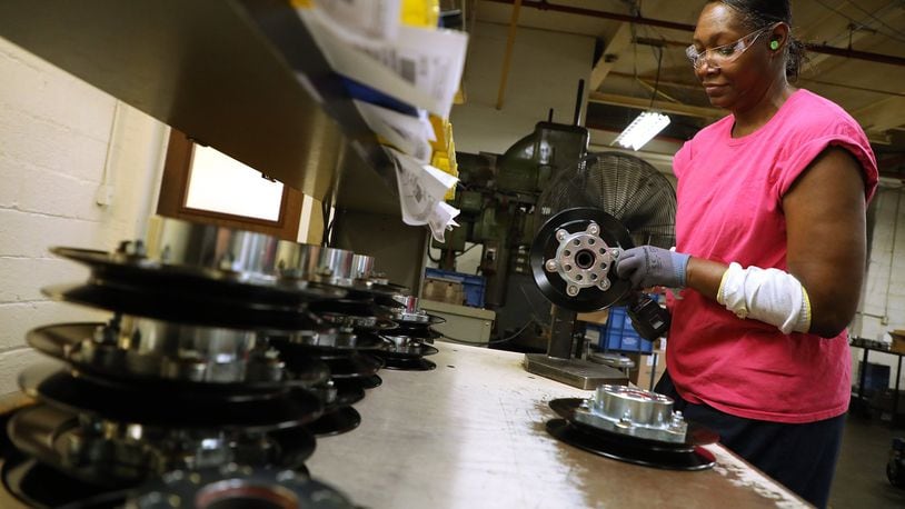 Christine Strickland, an employee of Morgal Machine Tool Co., assembles a pulley at the Springfield plant Tuesday, May 22, 2018. The company is boosting its wages to attract new workers. Bill Lackey/Staff