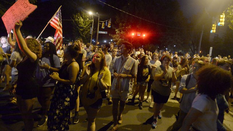 CHAPEL HILL, NC - AUGUST 22: Demonstrators attempt to march the streets but are turned away back toward campus to rally for the removal of a Confederate statue coined Silent Sam on the campus of the University of Chapel Hill on August 22, 2017 in Chapel Hill North Carolina. The city Mayor asked the university president to take proper means to remove the statue. (Photo by Sara D. Davis/Getty Images)