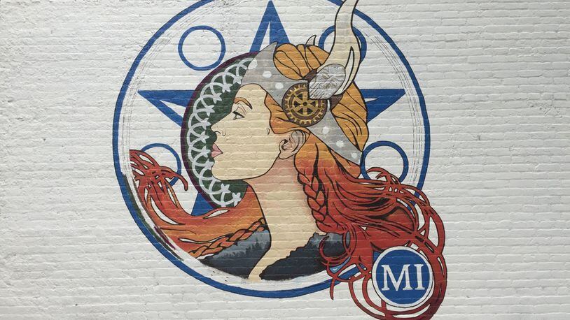 Still a work in progress, a mural of a lady viking is being painted on Miamsburg s Gwinner Building. The design, inspired by the Miamisburg High School mascot, is a collaboration between artists Jess McMillan and Jennifer Sayger and part of a series of community art projects. CONTRIBUTED