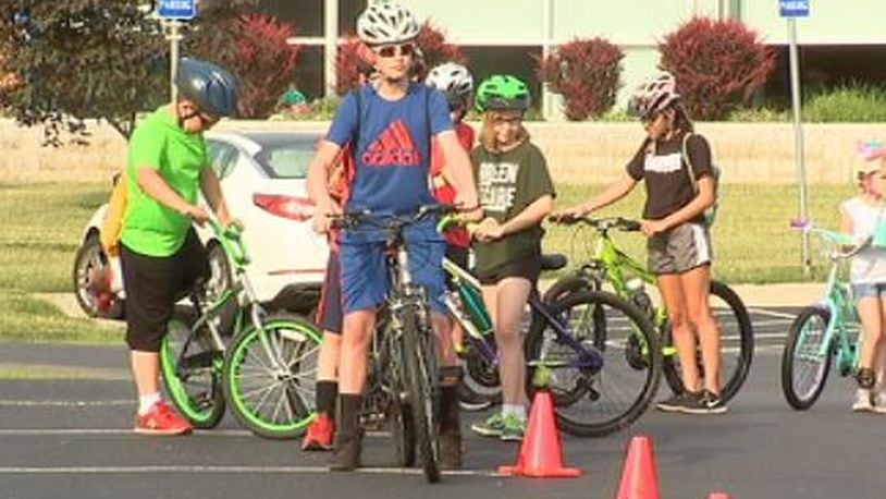 Participants, ages 6 - 13 years old, learn how to properly ride their bikes as park of the Springfield Police Division Bike Camp. JEFF GUERINI/STAFF
