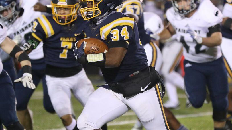 Springfield’s Tavion Smoot carries the ball against Fairmont. BILL LACKEY/STAFF