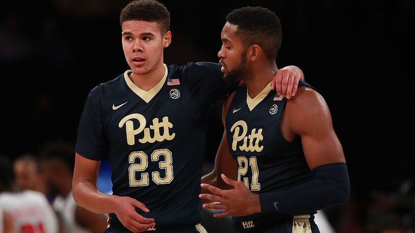 NEW YORK, NY - NOVEMBER 17: Cameron Johnson #23 and Sheldon Jeter #21 of the Pittsburgh Panthers talk against the Southern Methodist Mustangs in the first half during the 2K Classic at Madison Square Garden on November 17, 2016 in New York City. (Photo by Michael Reaves/Getty Images)