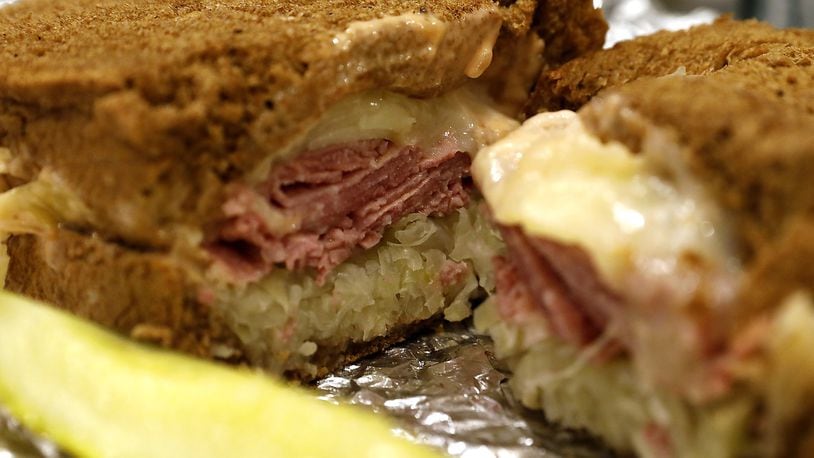 A Mike and Rosy’s Reuben sandwich piled high with meat, cheese and sauerkraut. BILL LACKEY/STAFF