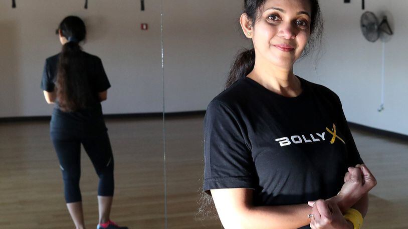 Vijaya Devatha in one of the dance poses for the Bolly X class and New Carlisle Sports and Fitness. Bill Lackey/Staff