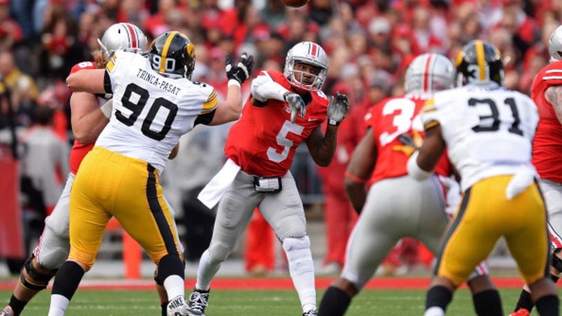 COLUMBUS, OH - OCTOBER 19: Quarterback Braxton Miller #5 of the Ohio State Buckeyes passes downfield in the second quarter against the Iowa Hawkeyes at Ohio Stadium on October 19, 2013 in Columbus, Ohio. (Photo by Jamie Sabau/Getty Images)