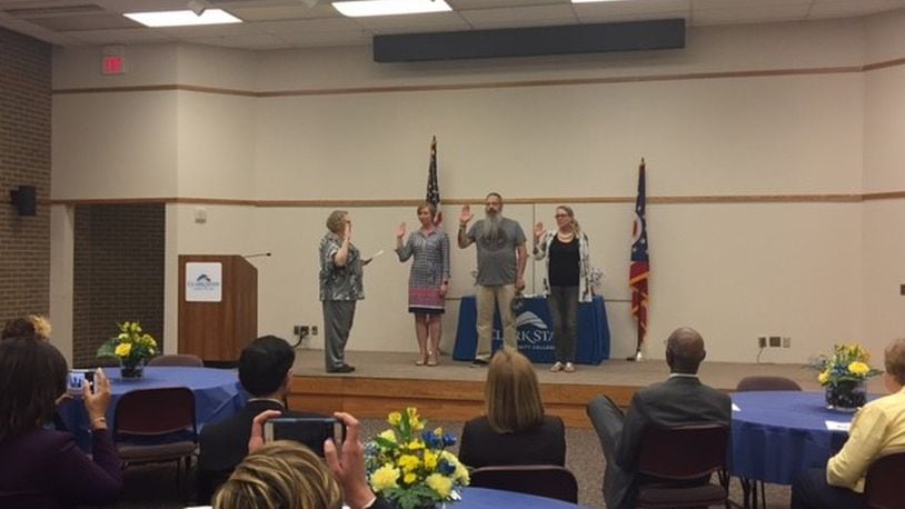 Dana Kapp, left, inducts Clark State Community College U.S. Military veteran students Denise Bloomfield, Brian Miller and Sherri Marsh into SALUTE Veterans National Honor Society on the school’s campus on Thursday, April 27. CONTRIBUTED PHOTO