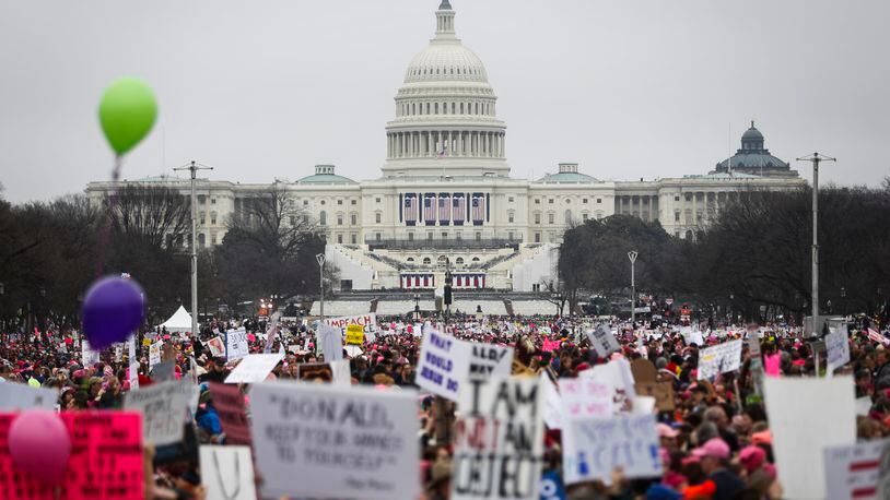 Protesters gather on the National Mall for the Women's March on Washington during the first full day of Donald Trump's presidency, Saturday, Jan. 21, 2017 in Washington. (AP Photo/John Minchillo)