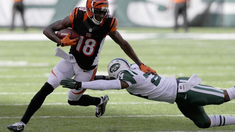 Darrelle Revis of the Jets tries to tackle Bengals wide receiver A.J. Green during their game at MetLife Stadium on September 11, 2016 in East Rutherford, New Jersey.