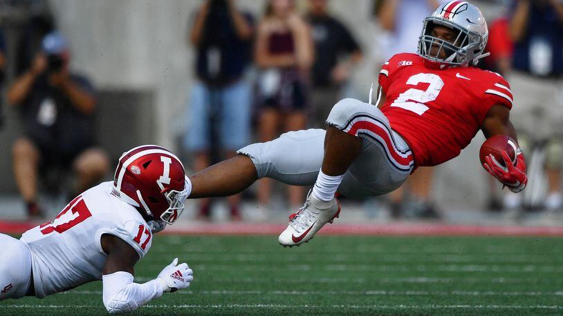 COLUMBUS, OH - OCTOBER 6: J.K. Dobbins #2 of the Ohio State Buckeyes is upended after a long gain in the first quarter by Raheem Layne #17 of the Indiana Hoosiers at Ohio Stadium on October 6, 2018 in Columbus, Ohio. (Photo by Jamie Sabau/Getty Images)