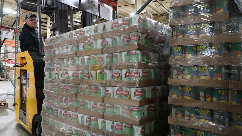 Demand on Second Harvest Food Bank is likely to feel strained as it pushes to serve families and children out of school for the next three weeks due to concerns over coronavirus. BILL LACKEY/STAFF