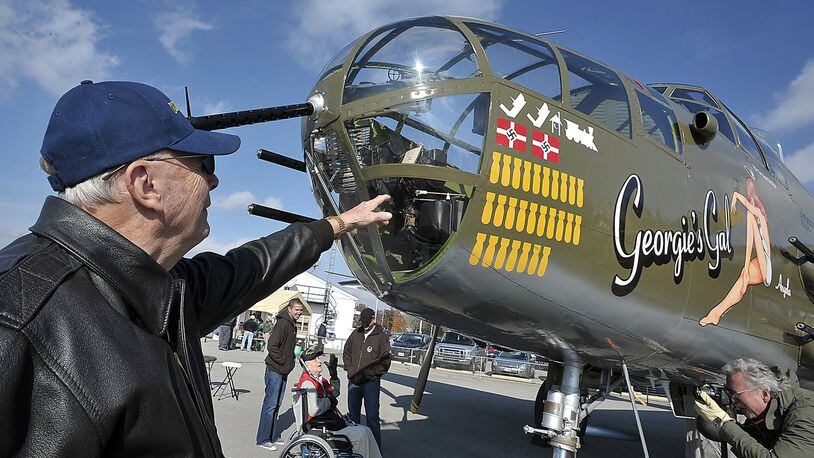 Cliff Johnson, of Cedarville, looks over the B-25 Mitchell bomber called “Georgie’s Gal” Friday at Grimes Field in Urbana. Johnson was a pilot during WWII and flew B-25’s. He and other veterans and airplane enthusiasts turned out to see the B-25’s that are staged in Urbana before they fly over the National Museum of the U.S. Air Force on Saturday to commemorate the Doolittle Tokyo Raiders’ final toast to their fallen brothers. Bill Lackey/Staff