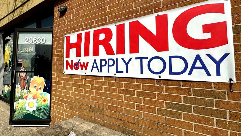 A hiring sign is displayed in Riverwoods, Ill., Tuesday, April 16, 2024. On Thursday, April 18, 2024, the Labor Department reports on the number of people who applied for unemployment benefits last week. (AP Photo/Nam Y. Huh)