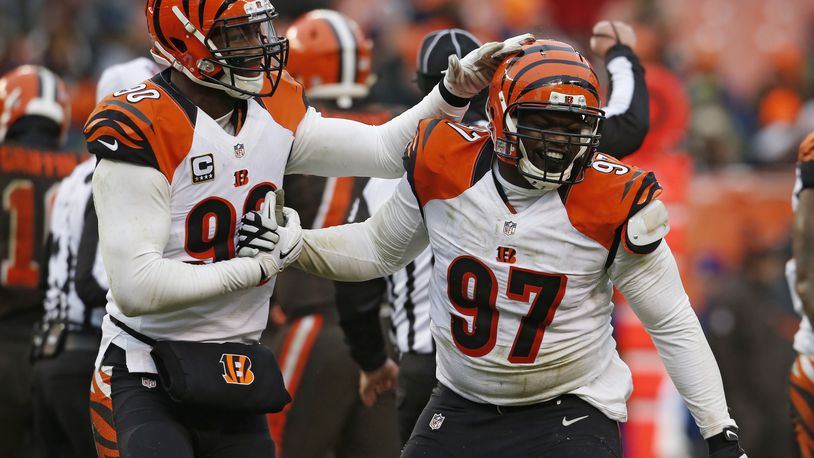 Cincinnati Bengals defensive tackle Geno Atkins (97) is congratulated after a sack in the second half of an NFL football game against the Cleveland Browns, Sunday, Dec. 11, 2016, in Cleveland. (AP Photo/Ron Schwane)