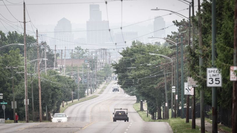 Summer haze surrounds Dayton from the top of Third St. hill. The weekend is forecast to be sunny and hot. JIM NOELKER/STAFF