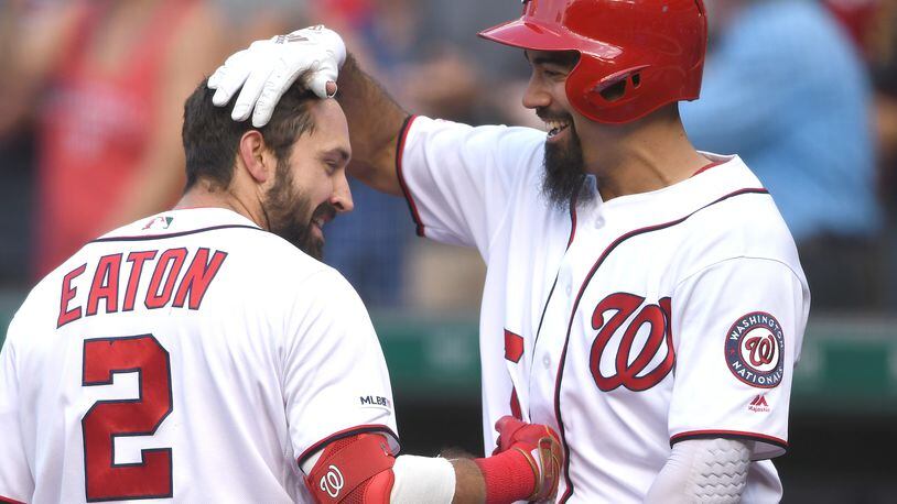 WASHINGTON, DC - AUGUST 14:  Adam Eaton #2 of the Washington Nationals celebrates a three home run with Anthony Rendon #6 in the fifth inning during a baseball game against the Cincinnati Reds at Nationals Park on August 14, 2019 in Washington, DC.  (Photo by Mitchell Layton/Getty Images)