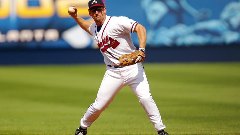 Keith Lockhart of the Atlanta Braves throws to base during game one of the National League Division Series against the San Francisco Giants at Turner Field in Atlanta, Georgia on October 2, 2002. The Giants defeated the Braves 8-5, giving them the first win in the five-game series.  (Photo by Jamie Squire /Getty Images)