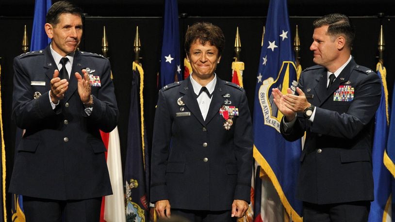 FILE: Col. John Devillier (right) became the new Installation Commander and 88th Air Base Wing commander in a ceremony held Thursday at the National Museum of the United States Air Force. Devillier replaces Col. Cassie Barlow (center) who has retired. At left is Lt. Gen. C.D. Moore, commander of the Air Force Life Cycle Management Center. LISA POWELL / STAFF