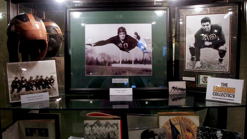 A collection of Vince Lombardi memorabilia from the Jack Giambrone collection is on display in the lobby of the Loft Theatre in downtown Dayton for the play "Lombardi." LISA POWELL / STAFF