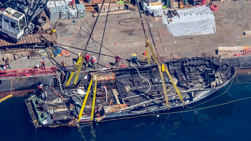 The burned hull of the Conception is brought to the surface by a salvage team, Thursday, Sept. 12, 2019, off Santa Cruz Island, Calif., in the Santa Barbara Channel in Southern California The vessel burned and sank on Sept. 2, taking the lives of 34 people aboard. Five survived.