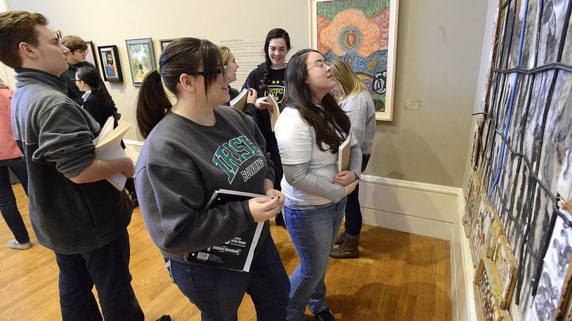 In 2015, Catholic Central art students looked over the Folk Art on display at the Springfield Museum during their weekly visit to the museum. The school participates in the national City Connects program. Bill Lackey/Staff