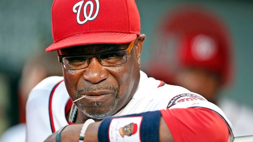 FILE - In this Sept. 13, 2016, file photo, Washington Nationals manager Dusty Baker pauses in the dugout before a baseball game against the New York Mets at Nationals Park in Washington. The Nationals announced Friday, Oct. 20, 2017, that Baker won't be back next season. Baker led the Nationals to the NL East title in each of his two years with the club. But Washington lost its NL Division Series both times. (AP Photo/Alex Brandon, File)