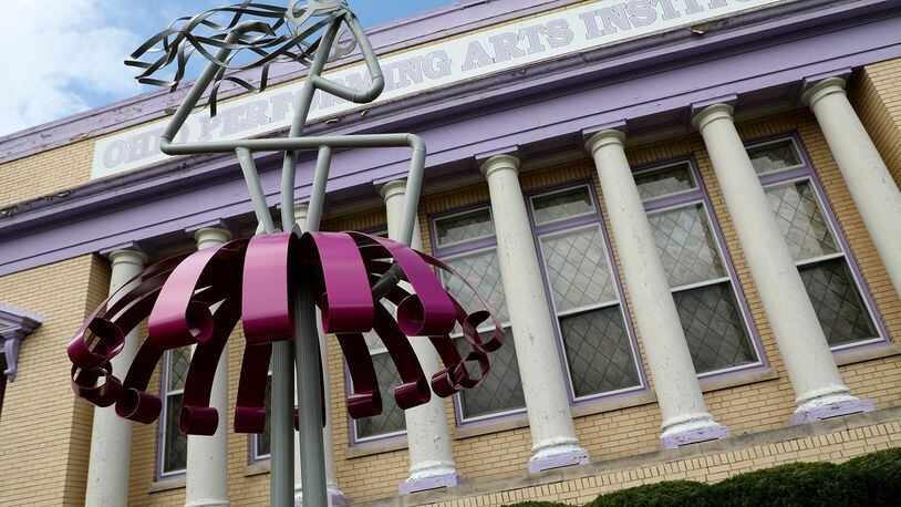 Marie McConnaughey’s welded art sculpture depicting an abstract ballerina in front of the Ohio Performing Arts Institute on East High Street. BILL LACKEY/STAFF