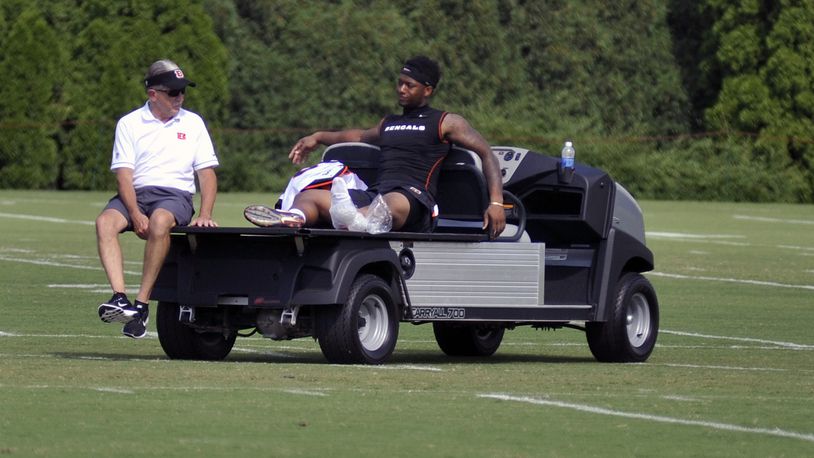 Cincinnati Bengals rookie running back Joe Mixon watches practice from a cart while icing his heel after getting kicked by a teammate during Thursday’s practice. JAY MORRISON/STAFF