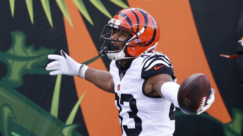 Cincinnati Bengals' Tyler Boyd (83) celebrates a touchdown reception during the second half of an NFL football game against the Tennessee Titans, Sunday, Nov. 1, 2020, in Cincinnati. (AP Photo/Gary Landers)
