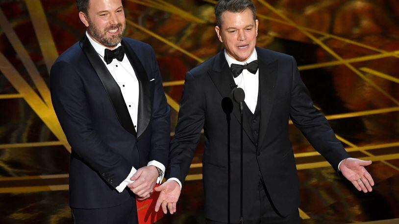Actor/director Ben Affleck (left) and actor/producer Matt Damon speak onstage during the 89th Annual Academy Awards on Feb. 26, 2017 in Hollywood, Calif. Both men were extras in 1989’s “Field of Dreams.” (Photo by Kevin Winter/Getty Images)