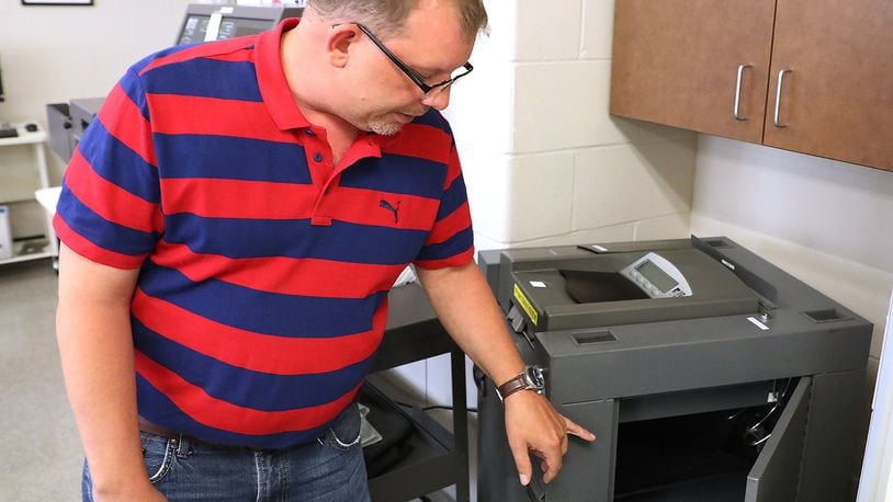 Clark County Board of Elections Director Jason Baker talks about some the repairs that have had to be made on some of the County’s aging voting machines. Bill Lackey/Staff