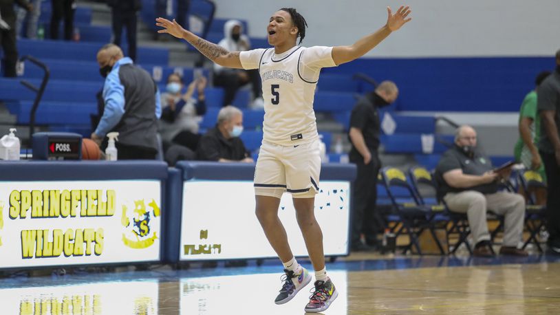 Springfield High School senior Josh Tolliver celebrates after beating Northmont 68-67 on Friday night at Springfield High School. Tolliver scored 26 points, including the game-winning basket with 4.2 seconds remaining. CONTRIBUTED PHOTO BY MICHAEL COOPER