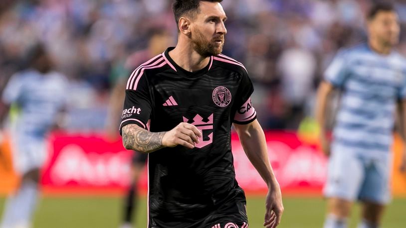 Inter Miami forward Lionel Messi (10) jogs to his position during the first half of an MLS soccer match against Sporting Kansas City, Saturday, April 13, 2024, in Kansas City, Mo. (AP Photo/Nick Tre. Smith)