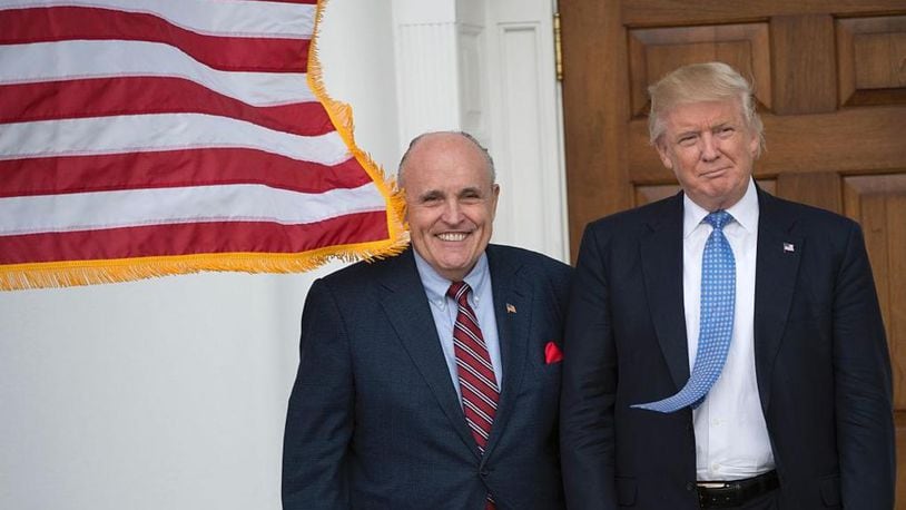 Then president-elect Donald Trump meets with former New York City Mayor Rudy Giuliani at the clubhouse of Trump National Golf Club November 20, 2016 in Bedminster, New Jersey.
