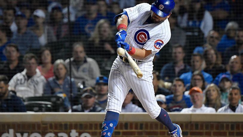 CHICAGO, ILLINOIS - SEPTEMBER 16: Kyle Schwarber #12 of the Chicago Cubs hits a three run home run in the first inning against the Cincinnati Reds at Wrigley Field on September 16, 2019 in Chicago, Illinois. (Photo by Quinn Harris/Getty Images)