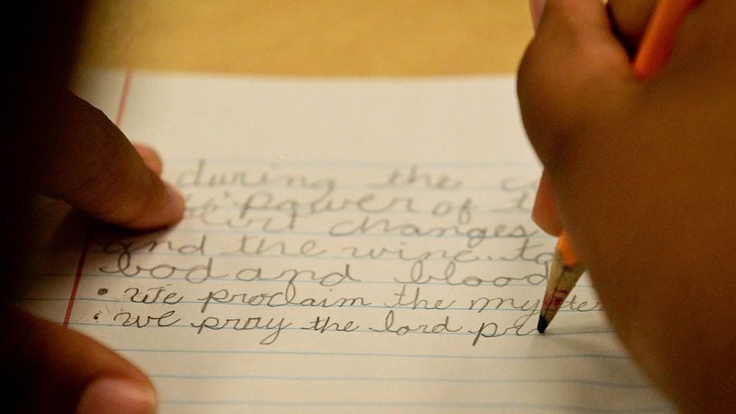Cursive writing is not required in the state curriculum. FILE PHOTO